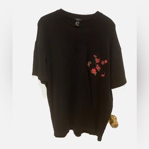 Forever 21 Tshirt.  Size Large, black with rose front pocket.  Used